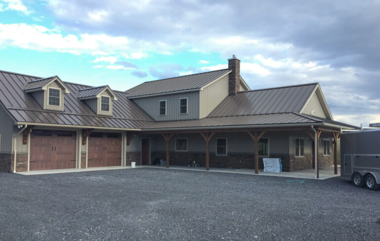 Post frame house with tan metal siding and roof