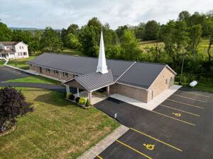 Top view of a Church with black frost standing seam roof