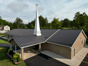 Front view of a Church with black frost standing seam roof