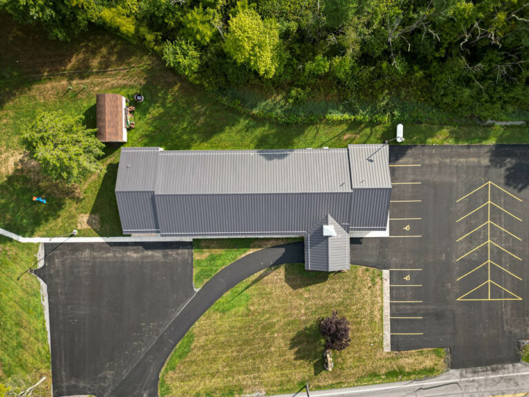 Top view of a Church with black frost standing seam roof