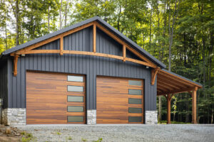 Garage view of a house with a black frost G-Rib roof and siding