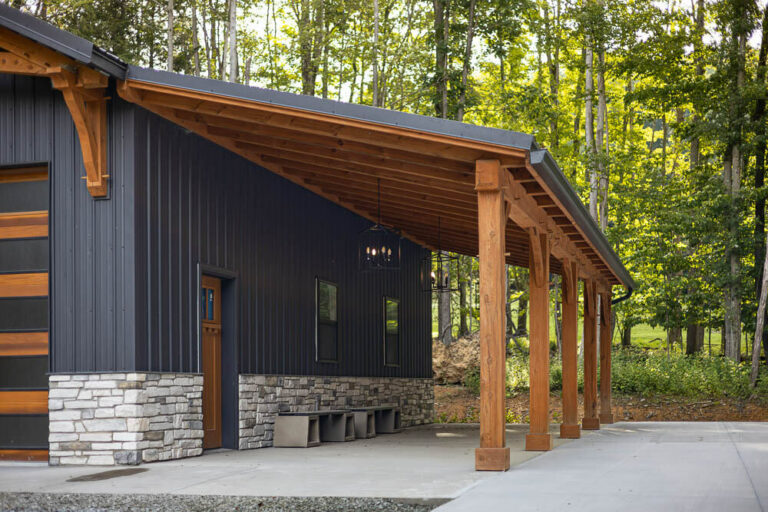 Porch on a house with a black frost G-Rib roof and siding